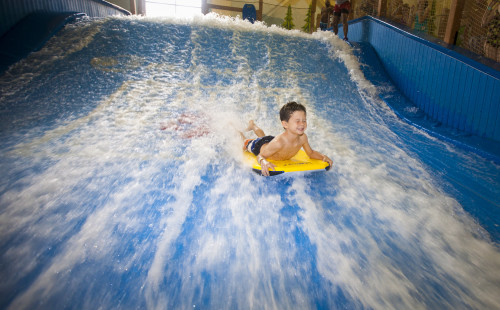 Surfing the Wolf Rider Wipeout. Photo credit: Great Wolf Lodge.