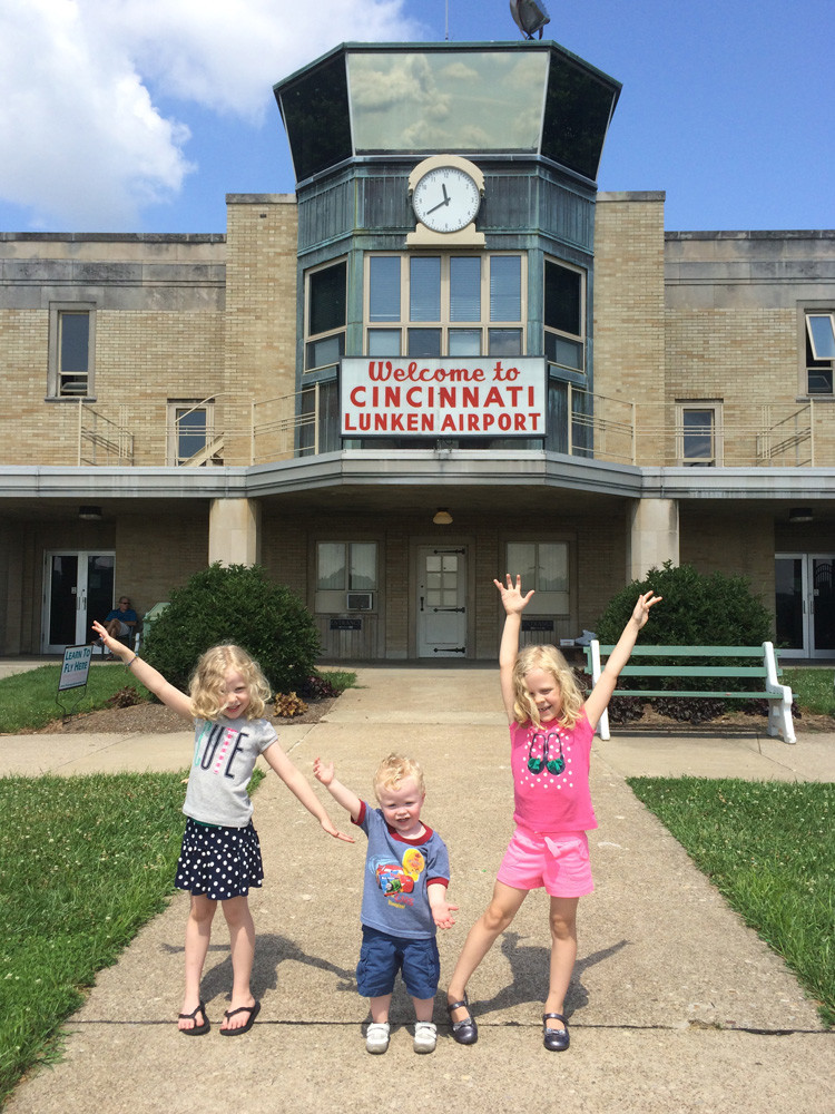 children stand outside of Lunken Airport, one of locals' favorite free Cincinnati activities, after watching the planes