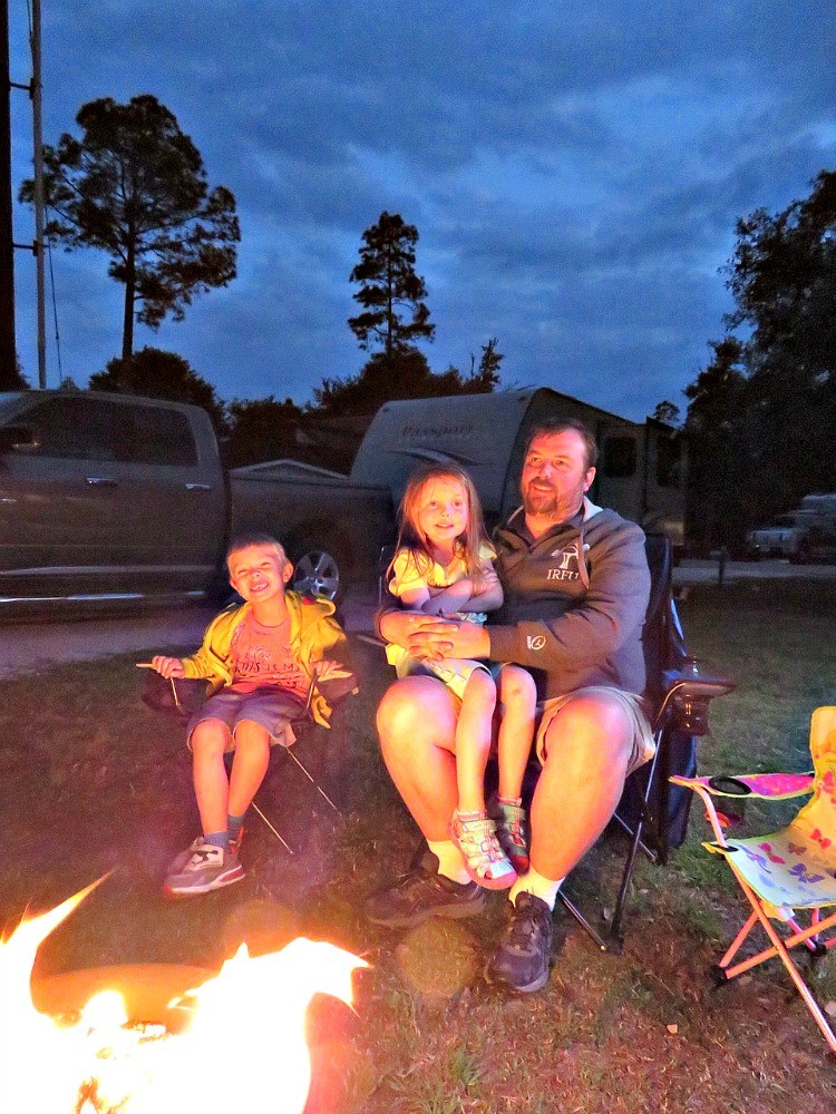 Gather round the campfire when families go travel trailer camping.