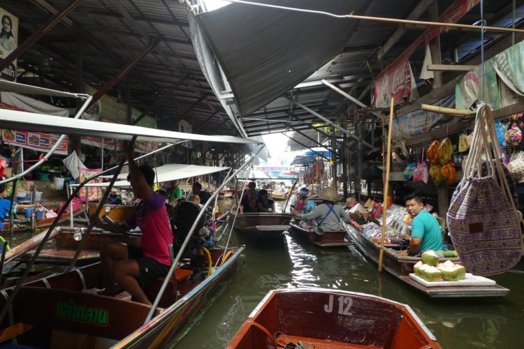 Shopping is fun at the Dumnoen Saduak floating market outside of Bangkok, Thailand with kids.