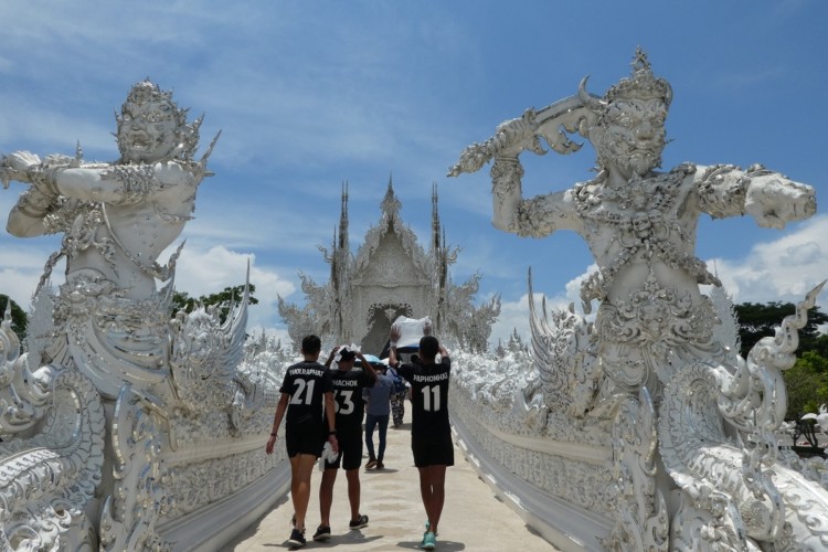 Walking into the White Temple in Chiang Rai, Thailand with kids.