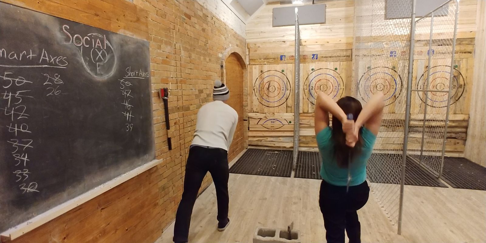 Fun things to do in Ogden after a day on the slopes includes a friendly game of axe throwing.