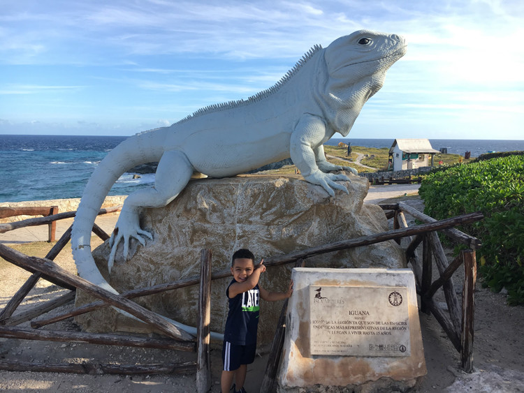 A giant iguana statue at Punta Sur in Isla Mujeres is a perfect spot for a photo when visiting Cancun with kids. 