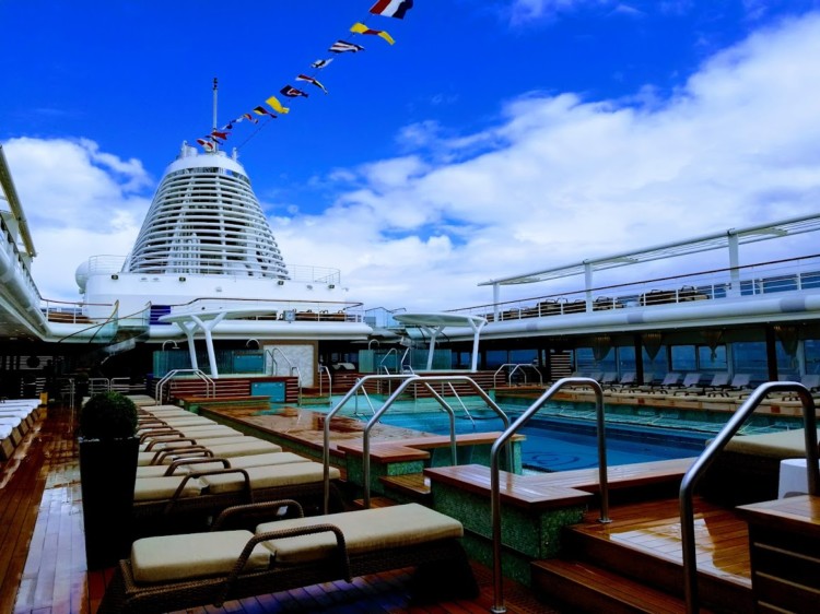 Cruising Europe in style includes lounging on the top deck pool of the Regent Seven Seas Cruise.