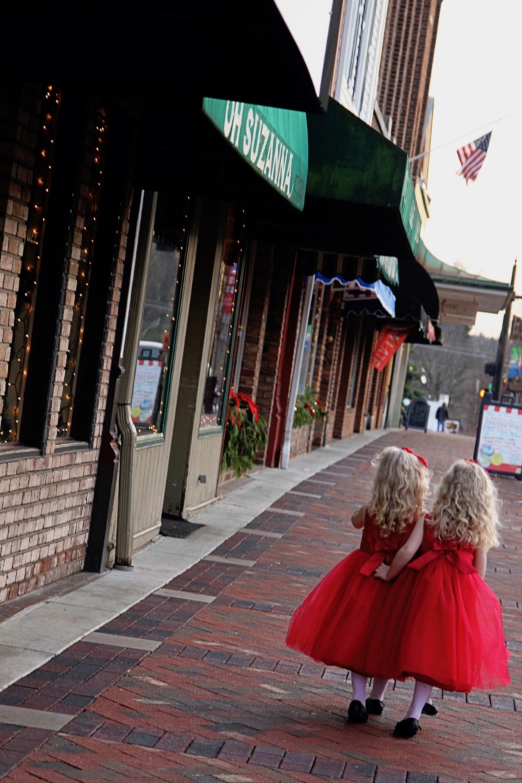 twin girls walk alongside a cobblestone road in Historic Lebanon, Ohio