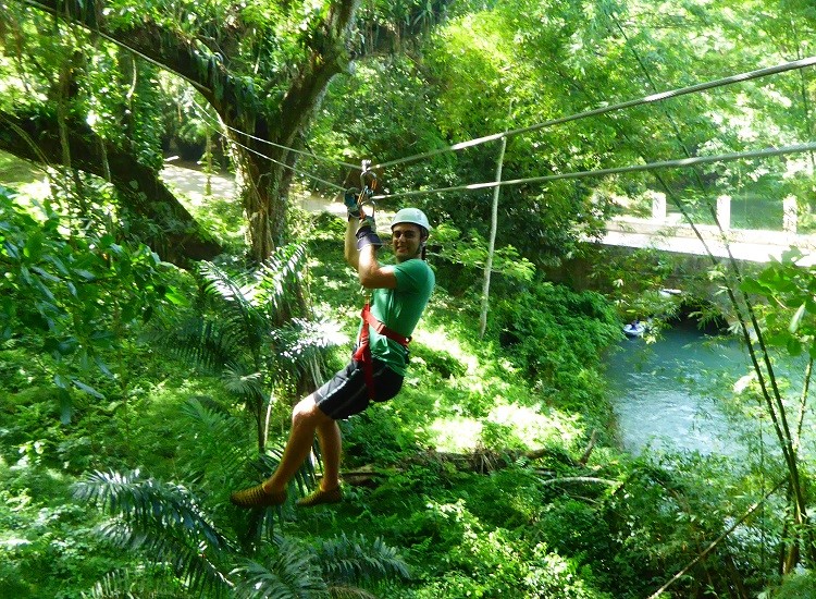 Family ziplining with young adult kids on Jamaica.
